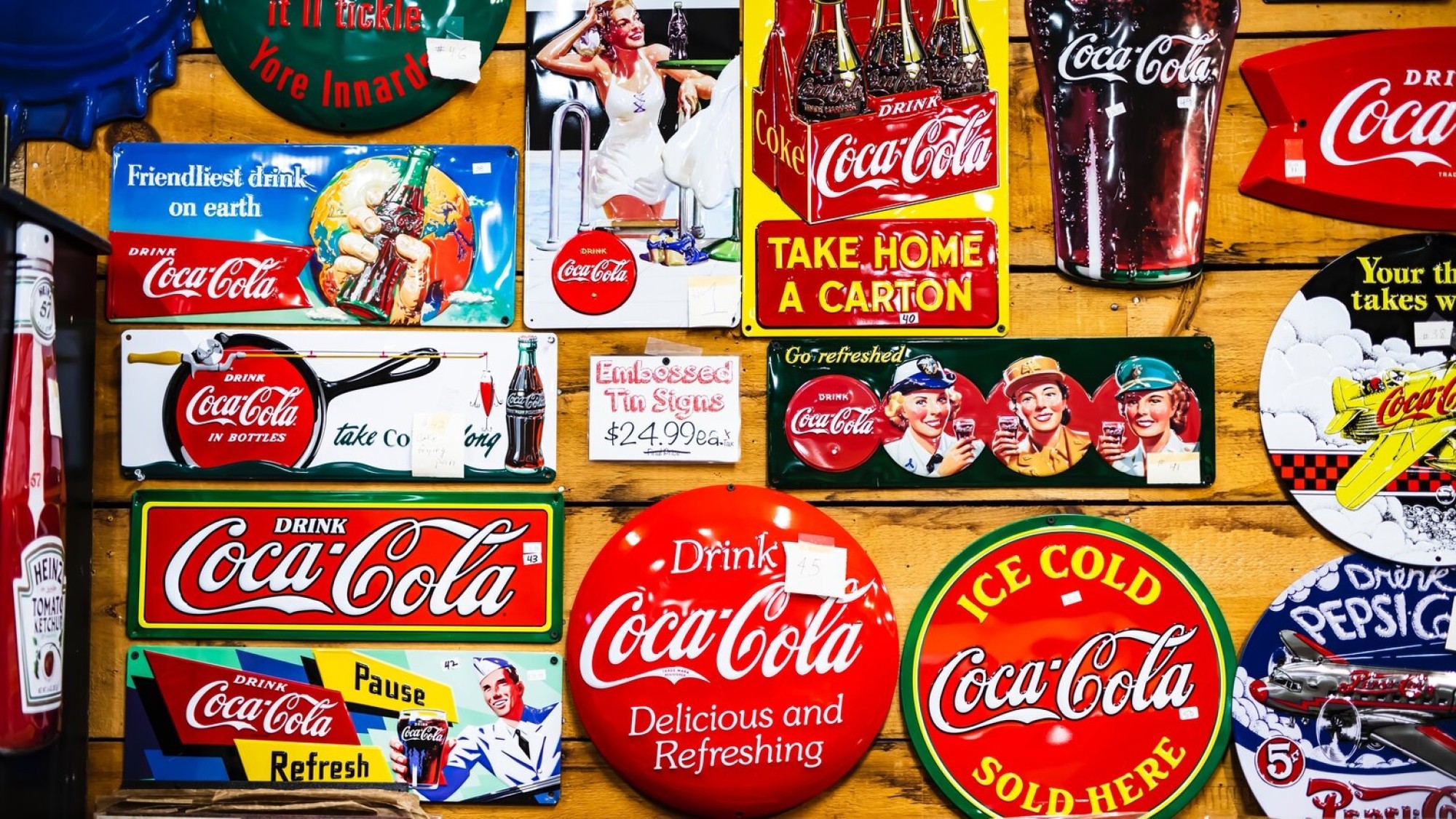 Vintage Coca-Cola signs are considered classic American memorabilia and are still a popular choice of decor until this day. title=